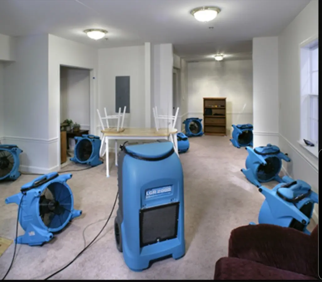Air movers and dehumidifier setup for Water Damage Restoration in Tiverton